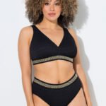 juodas bikinis su auksiniais apvadais