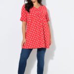 oranzine tunika su baltais taskais ir klostemis