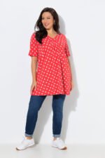 oranzine tunika su baltais taskais ir klostemis